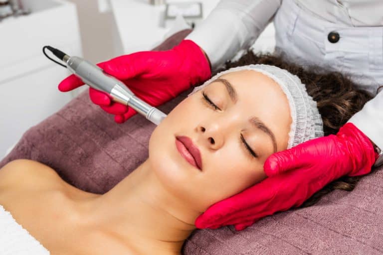 Aesthetician Giving Microneedling Treatment to Young Woman | Movel Medical Aesthetics in Brentwood, CA