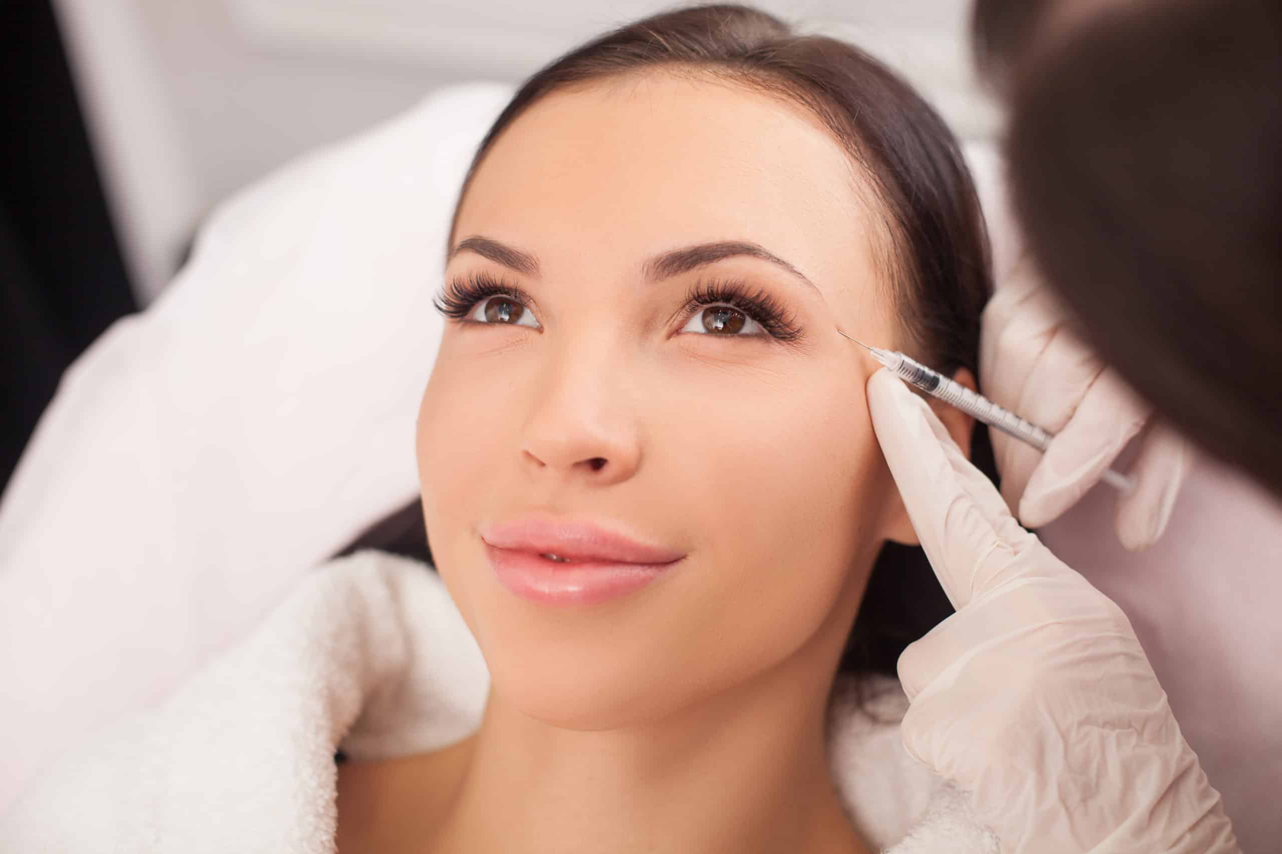 Beautiful Young Woman Getting Botox Injection Near to Eye Brow | Movel Medical Aesthetics in Brentwood, CA